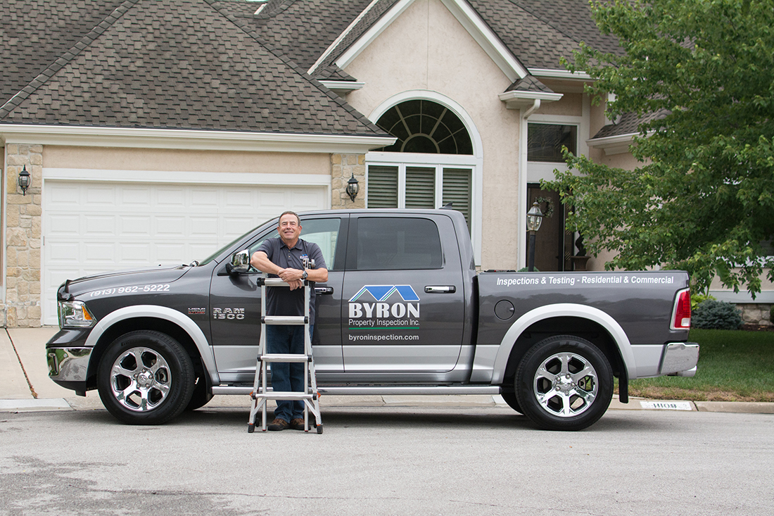 John Byron and his truck with Byron Property Inspections, INC logo